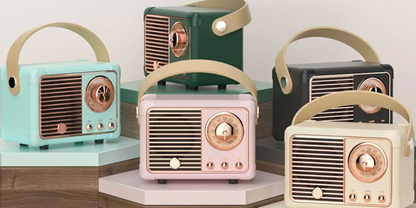 A product shot of teal, green, pink, black, and beige mini retro speakers.